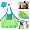 A large mesh green tote bag is shown being used by a child on a beach, with an accompanying blue fabric item.