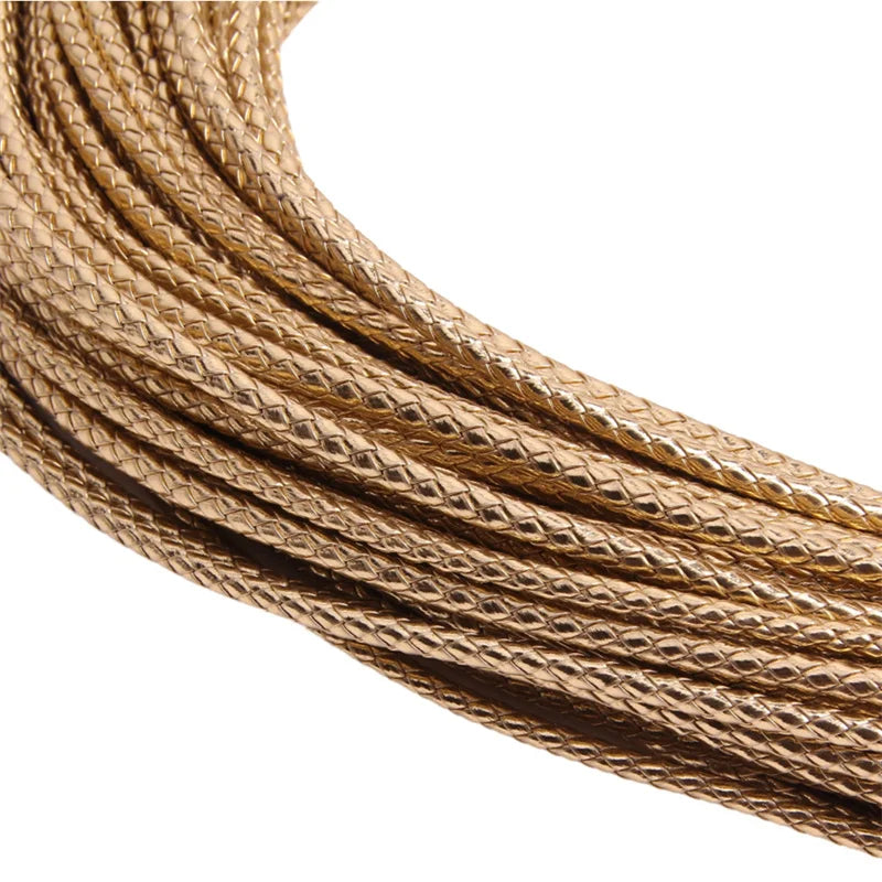 A spool of braided leather cord for jewelry making in a golden brown color.