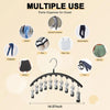 A black stainless steel multi-use hanger with ten clips used to organize various types of pants and clothing.