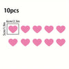 Ten pink heart-shaped stickers for night safety and car decoration, measuring 6cm/2.3in.