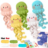 A collection of crocheted animal toys in various pastel colors including pink, yellow, green, and blue.