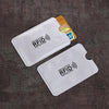 A set of ten white RFID protection card sleeves is displayed on a dark gray surface.