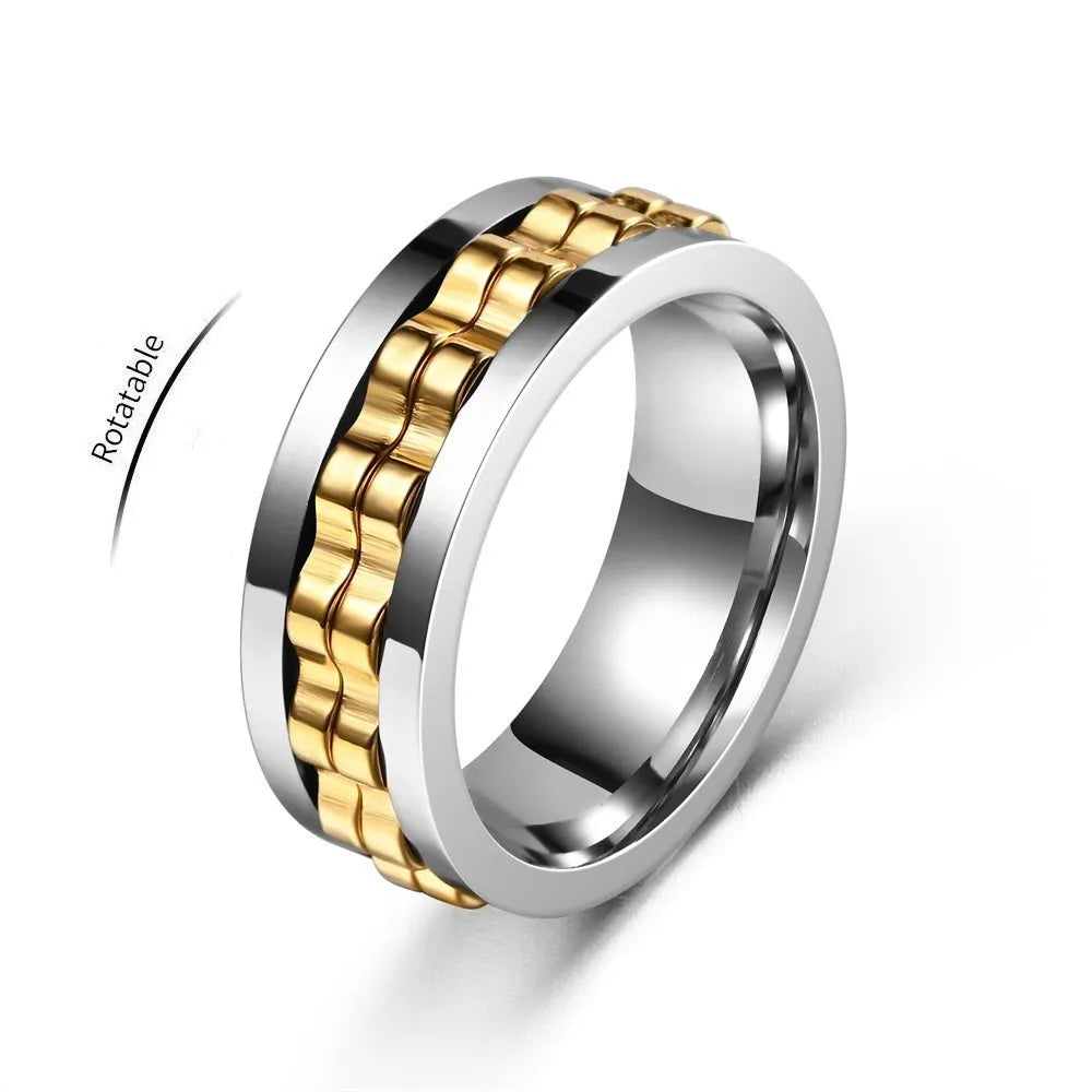 A silver ring with a gold gear chain design, shown rotating on a white background.