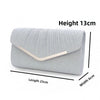 Silver pleated envelope clutch with a gold accent and detachable chain strap, shown flat.