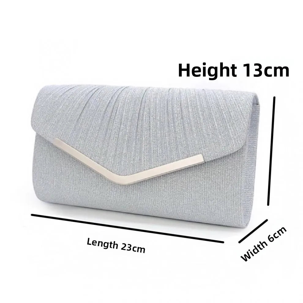 Silver pleated envelope clutch with a gold accent and detachable chain strap, shown flat.