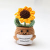 Handmade crochet sunflower doll with a brown body and bright orange petals.