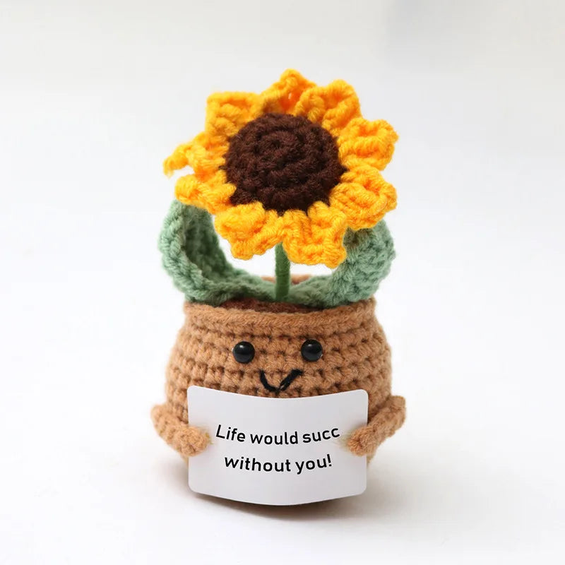 Handmade crochet sunflower doll with a brown body and bright orange petals.