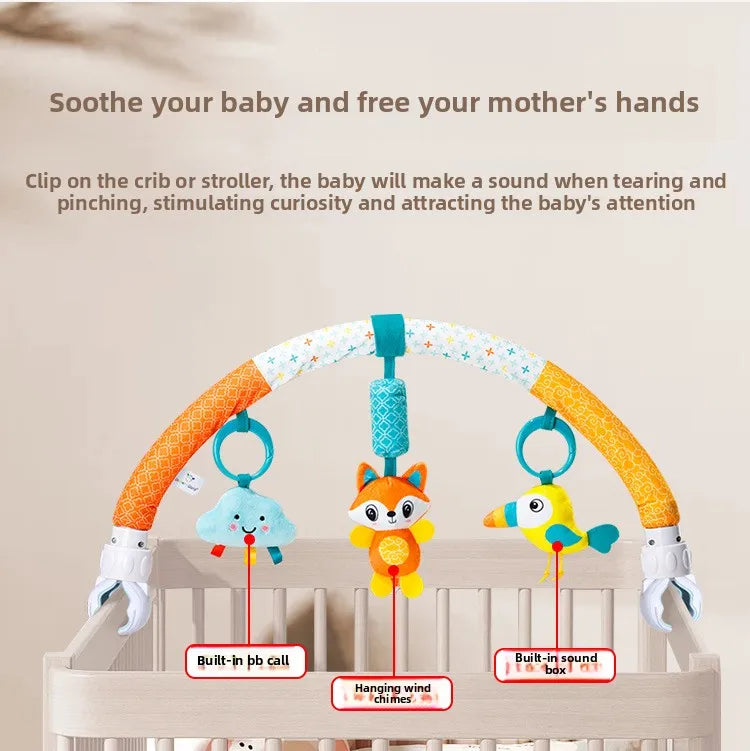 A baby stroller arch toy featuring hanging plush charms for soothing babies and stimulating curiosity.