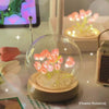 Handcrafted tulip LED night light with pink flowers on a wooden base.