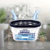 A white interior dehumidifier box with a black lid is shown surrounded by water spray, emphasizing its ability to eliminate m