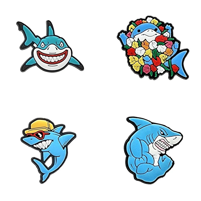 A set of three PVC pins featuring characters from Finding Nemo, including a clownfish, a sea turtle, and a shark.