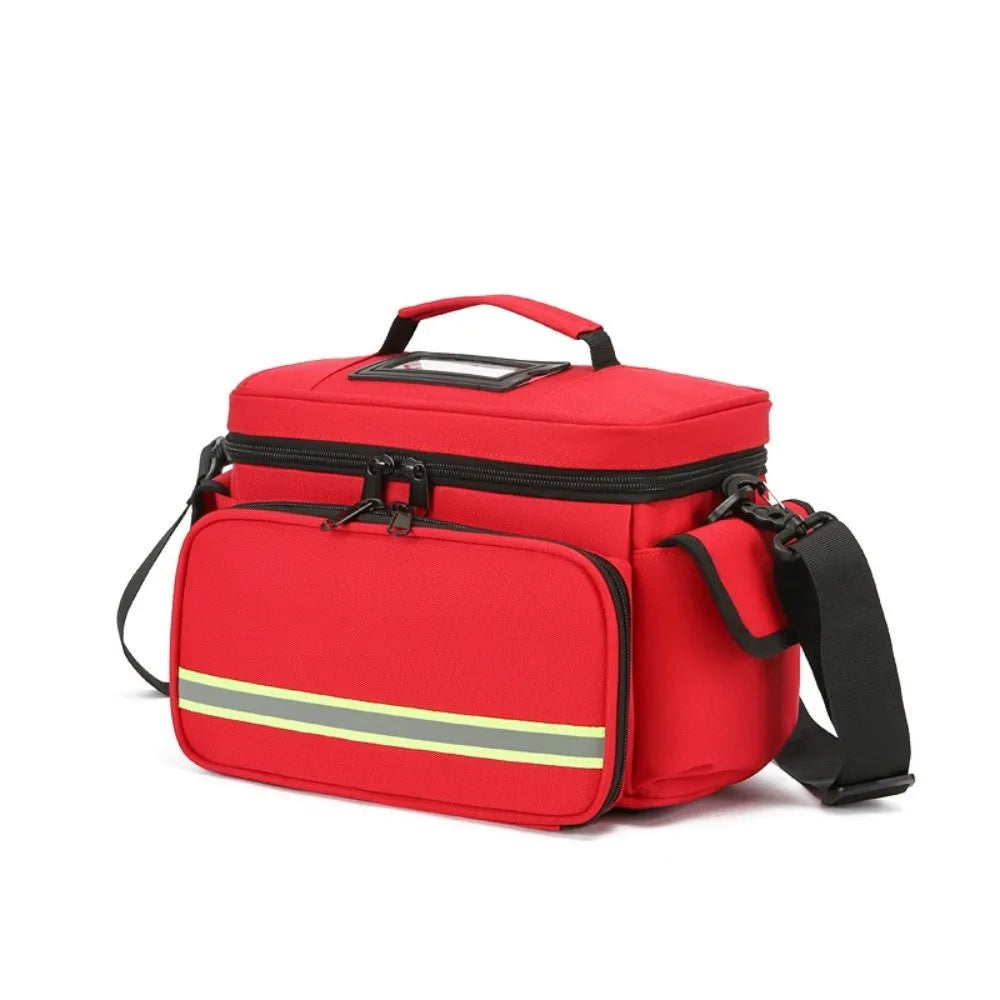 A red waterproof double-layer trauma and first aid bag with black straps and a yellow stripe.