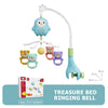 A light blue owl crib mobile with hanging toys and a green bell for a treasure bed ringing bell