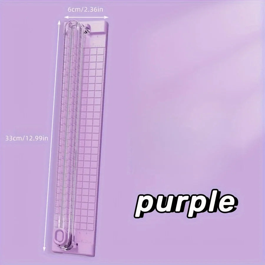 Règleuse manuelle portable de couleur violette, dimensions 33 cm par 6 cm.