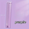 A purple portable paper cutter trimmer with measurements marked on the side.