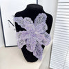 Purple sequin floral lace applique patch for sewing and DIY crafts displayed on a black mannequin.