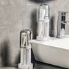 Modern bathroom toothbrush holder with a clear dust cover and drainage system on a white countertop.