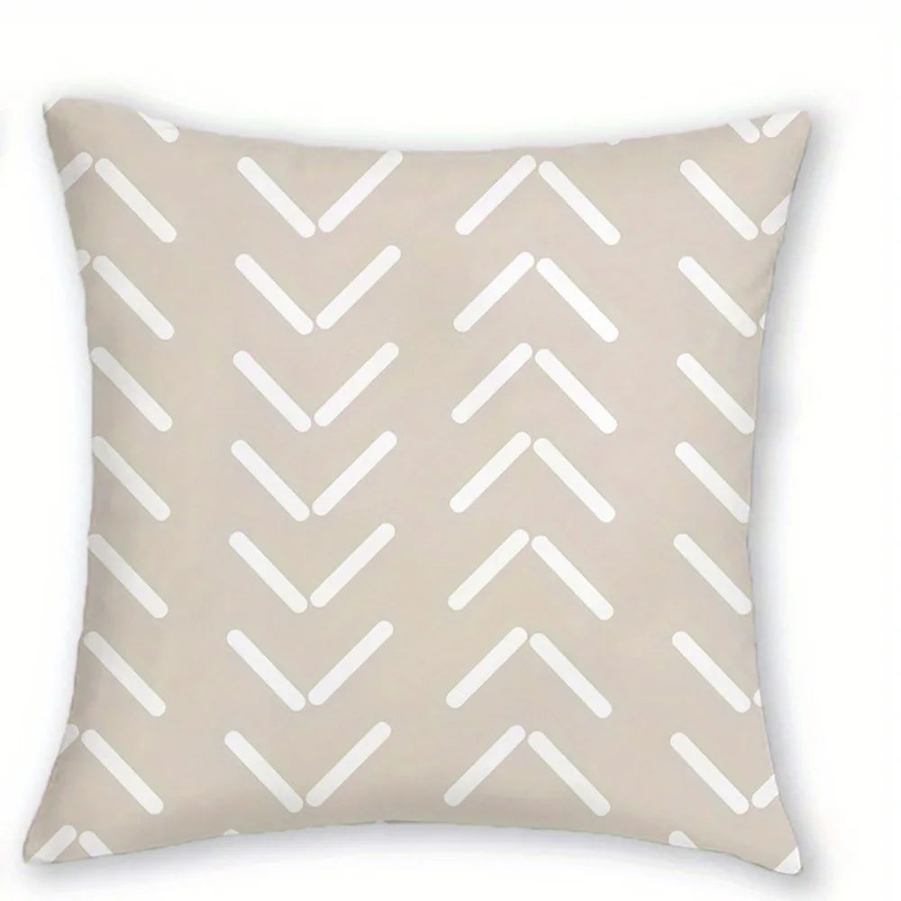 A beige decorative pillowcase featuring a repeating pattern of white chevron arrows.
