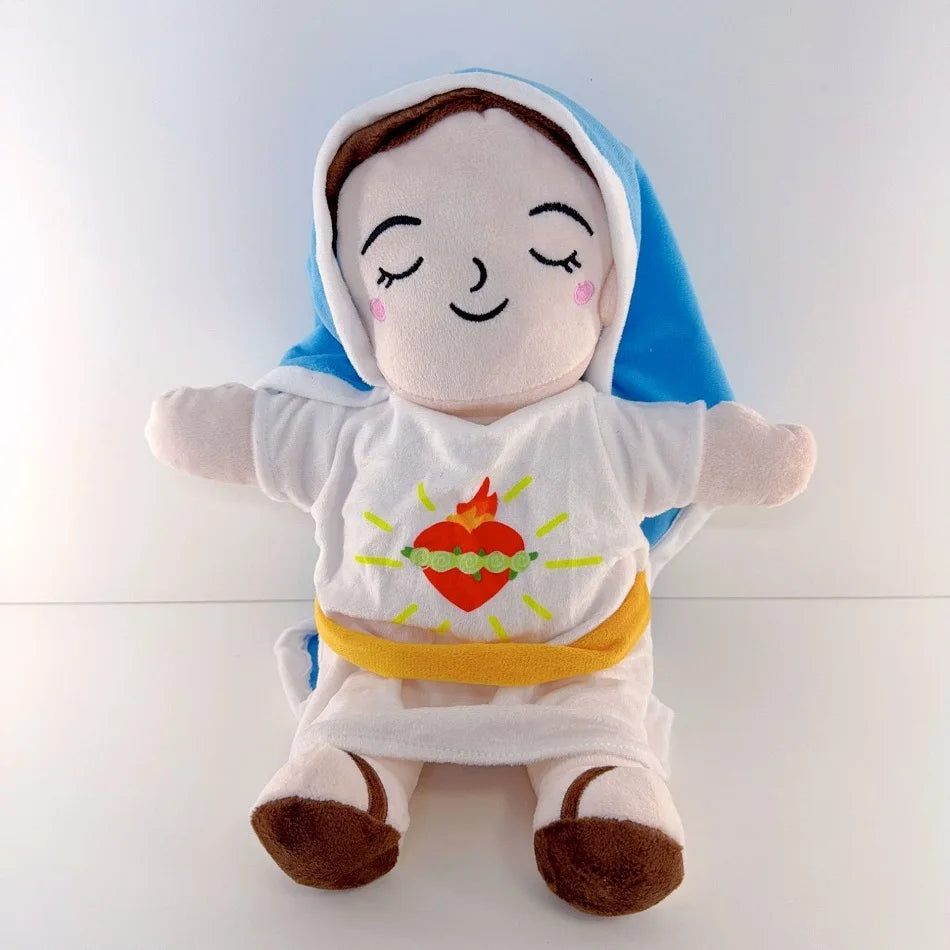 A soft plush doll of Jesus with a blue hood and white garment, featuring closed eyes and a smiling expression.