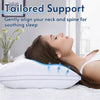 A woman rests her head on a white pillow featuring blue alignment points for soothing sleep.