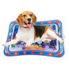 A dog with brown and white fur is lying on a blue inflatable water play mat.