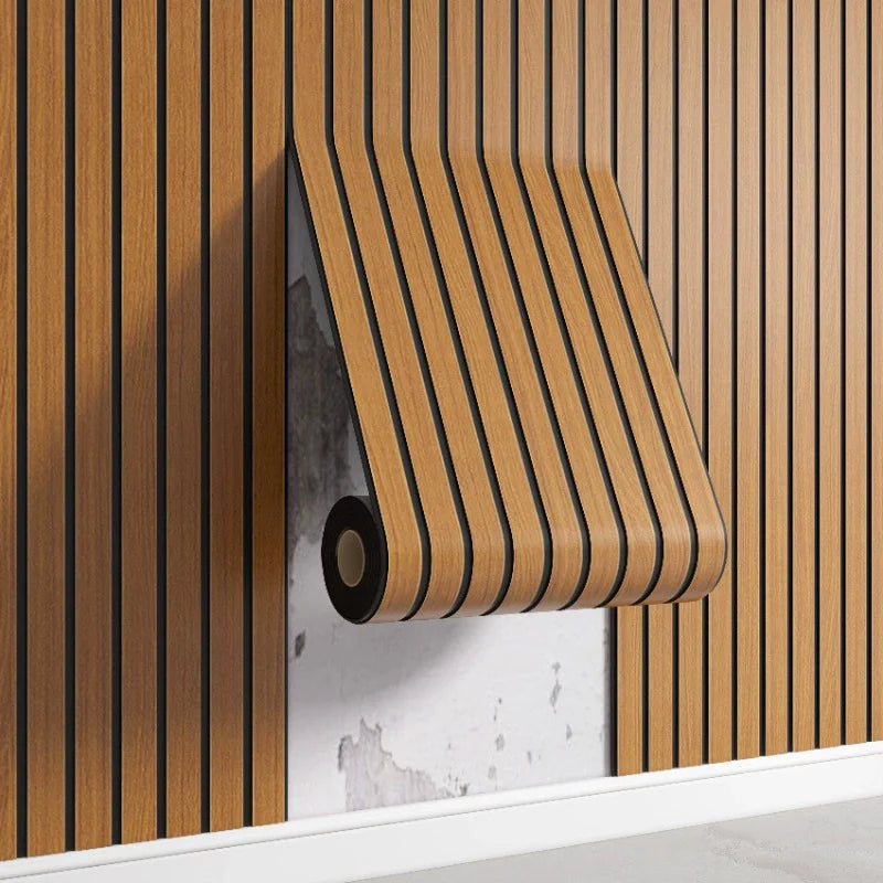 A close-up of a wooden peel-and-stick wall panel installed on a vertical wood slat background.
