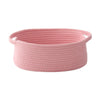 A pink handwoven rope storage basket with handles.