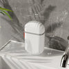 A white portable travel soap box with a drainage lid is shown on a light surface against a gray marbled background.
