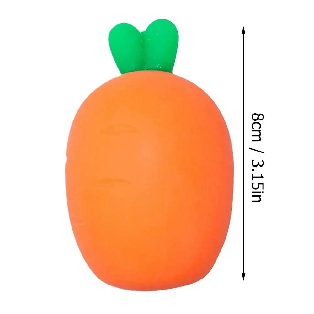 An orange squishy toy shaped like a carrot with green leafy tops.