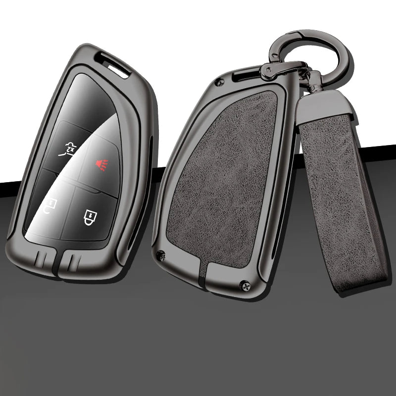 A black car key case made of durable zinc alloy and leather with a metal keyring attached.