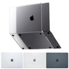 A stack of three Apple MacBook cases in silver, white, and dark gray colors.