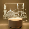A glowing acrylic night light depicting a mosque silhouette with domes and minarets.
