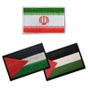 Two embroidered flag patches featuring green, white, and red stripes with a red emblem on a black background.