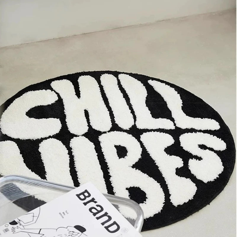 A round black and white letter carpet featuring the word CHILLUBES.