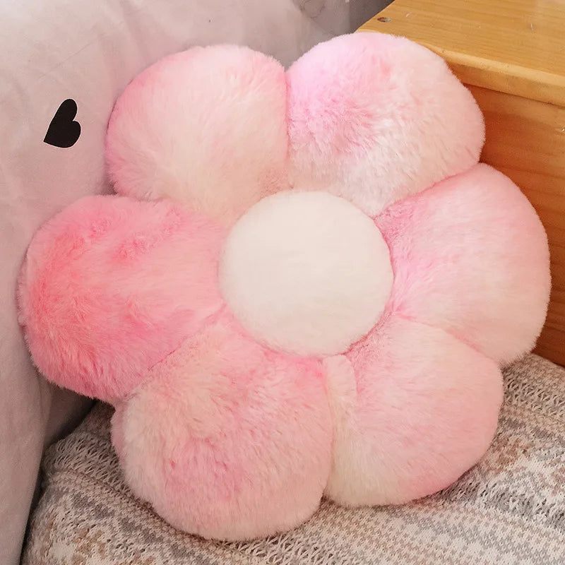 A pink and white lifelike sunflower plush pillow with soft furry texture.