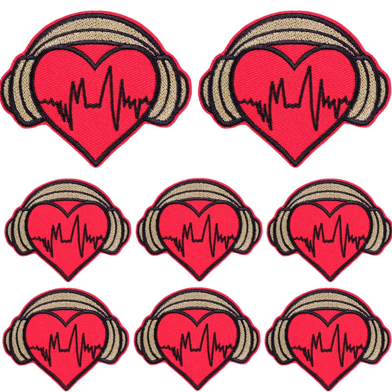A set of ten embroidered iron-on patches featuring a red heart design with a black heartbeat line on a gold background.