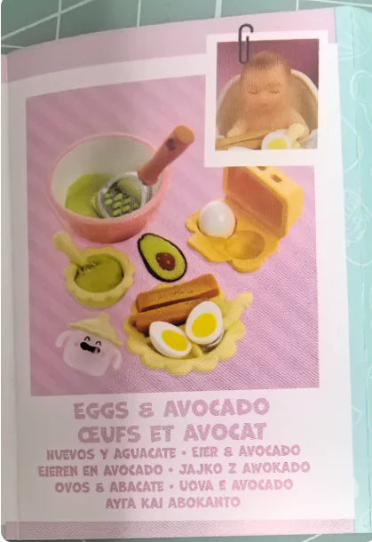 A DIY kit featuring a real baby mini doll and miniature food accessories like eggs and avocado.
