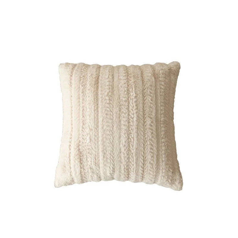 A beige knitted plush decorative pillow cover with vertical ribbing.