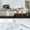 Rolls of white marble contact paper showing the adhesive backing for kitchen and furniture use