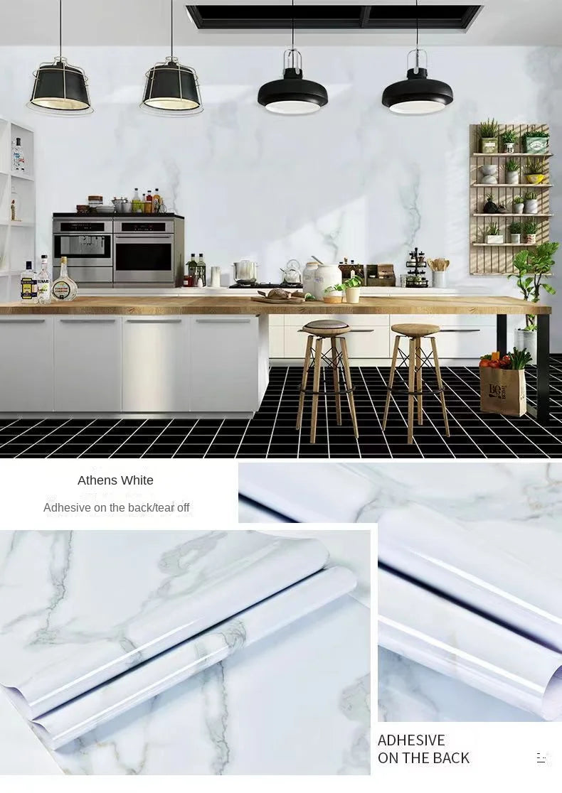 Rolls of white marble contact paper showing the adhesive backing for kitchen and furniture use