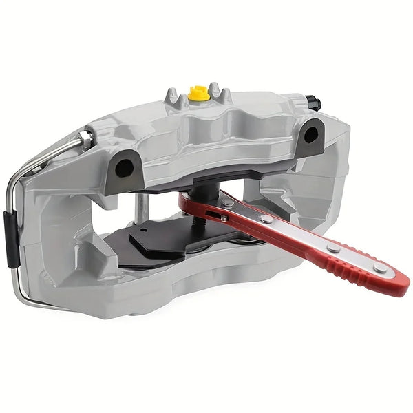 A gray ratcheting brake caliper press tool with a red handle and yellow component.
