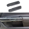 Two carbon fiber door handle covers for a Ford Mustang, shown against a dark car interior background.