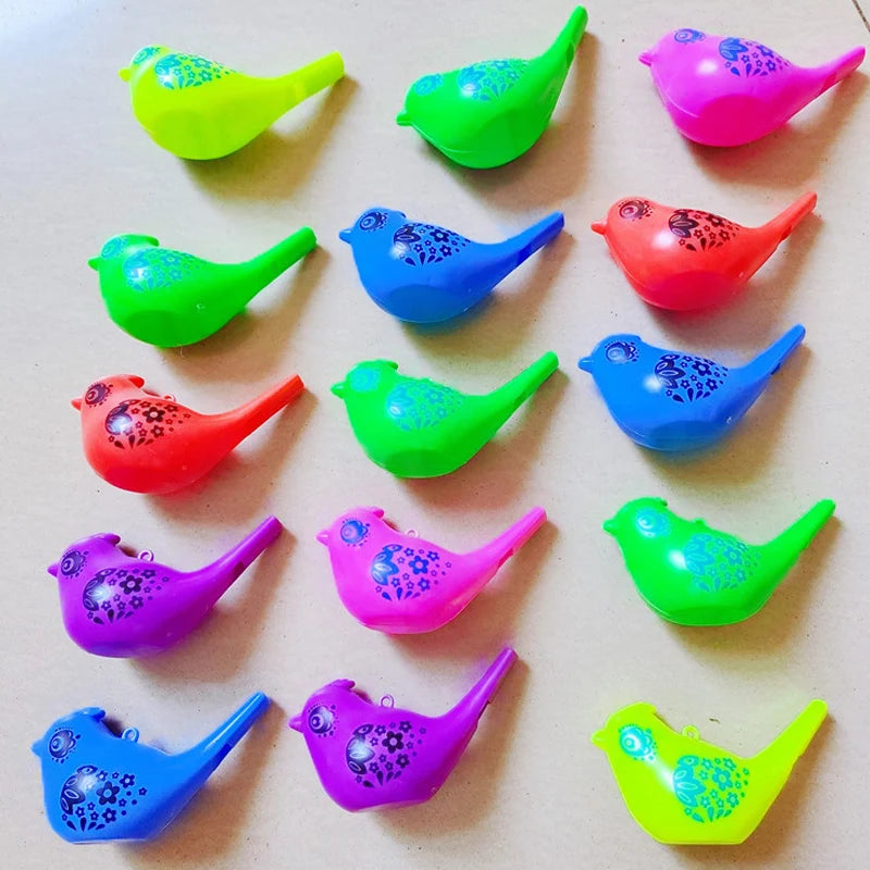 A collection of colorful plastic bird whistles in various shades including yellow, green, pink, and blue.