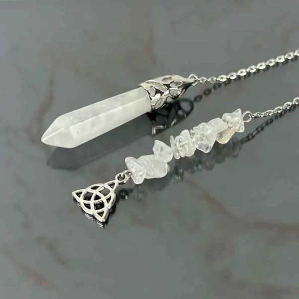 Silver pendant necklace featuring a long white quartz crystal and smaller quartz crystals for dowsing