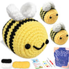 A yellow and black crocheted animal amigurumi set featuring a bee, along with yarn and tools.