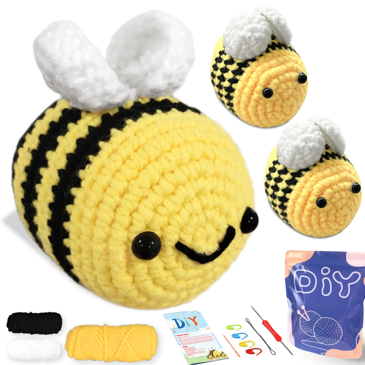 A yellow and black crocheted animal amigurumi set featuring a bee, along with yarn and tools.