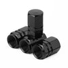 Set of four black aluminum alloy wheel tire valve caps with a hexagon design