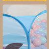 A blue and white ball pit with a mesh section showing colorful plastic balls.