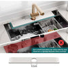 A stainless steel faucet mat with a handle is shown next to a black sink, demonstrating its use for quick-drying kitchen or b