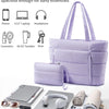 A purple quilted puffy tote bag is shown alongside various daily essentials like a phone, laptop, cosmetics, and keys.